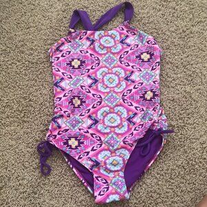 Colorful pattered justice bathing suit with open back